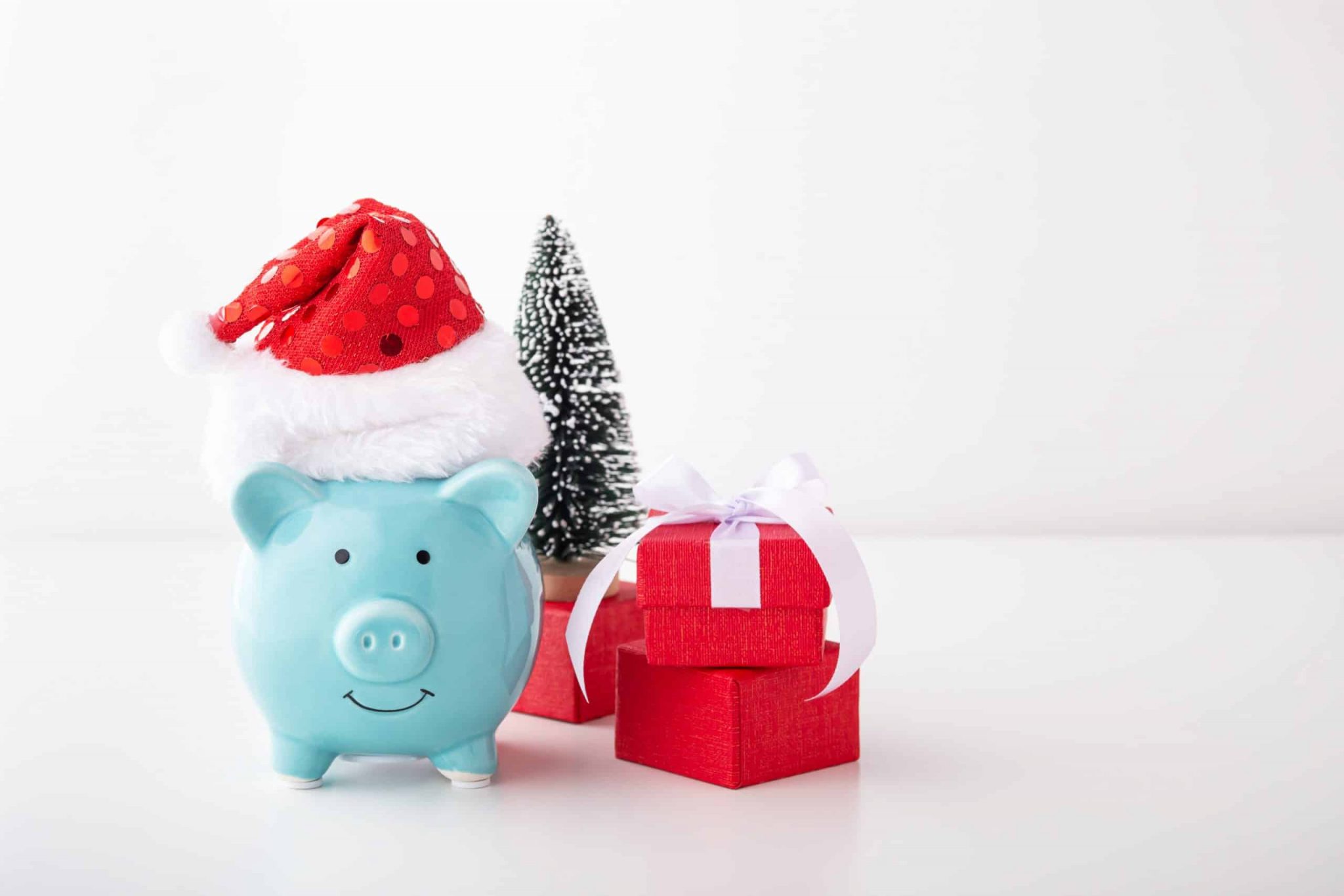 piggy bank with christmas hat gift decor white background min
