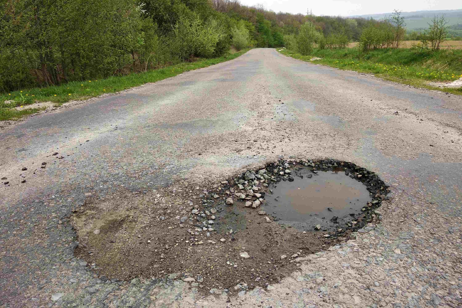 Hate Potholes? How Auto Insurance Can Save Your Wheels (and Wallet!)